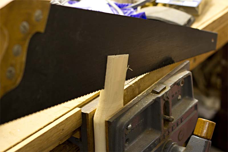 Sawing the kerf of the ax handle